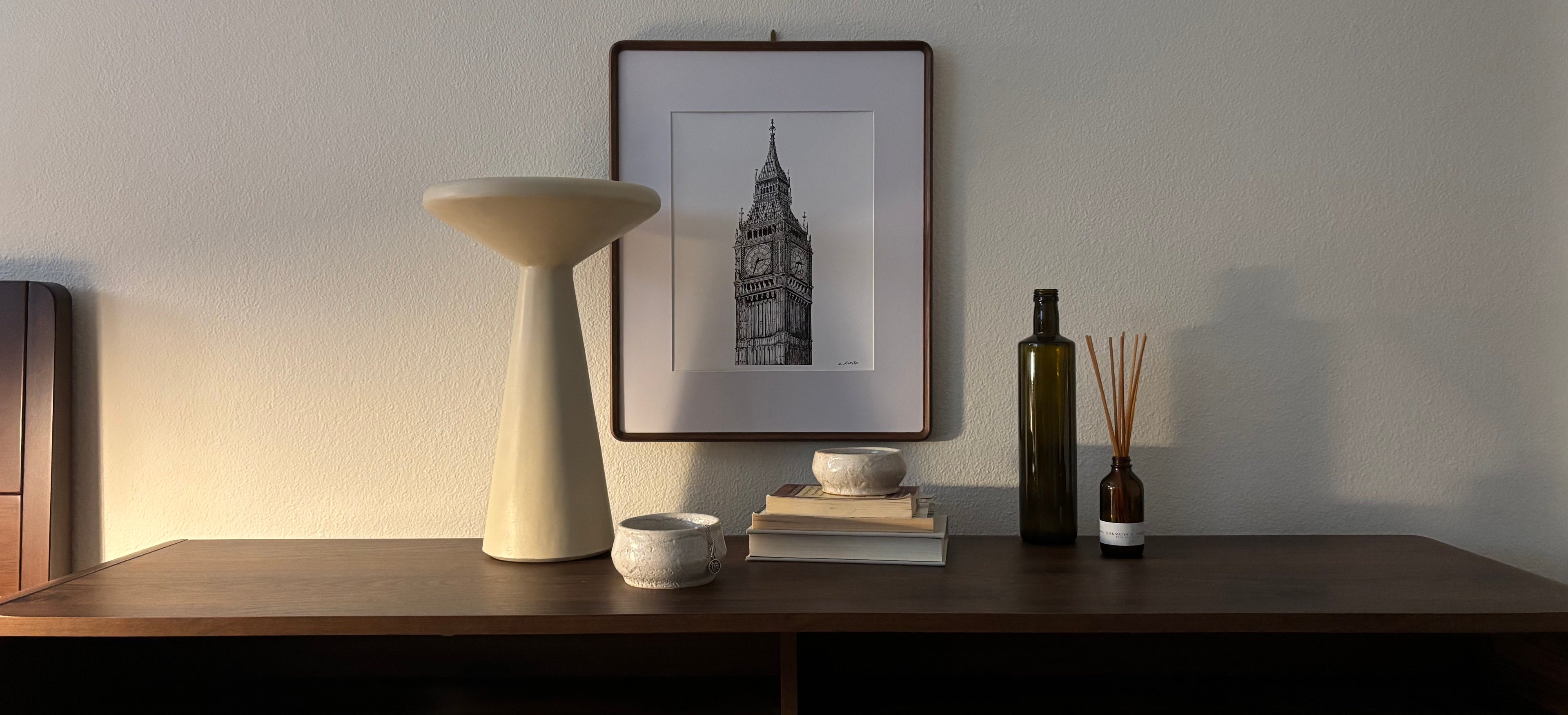 Big Ben art print in frame with styled decor arrangement